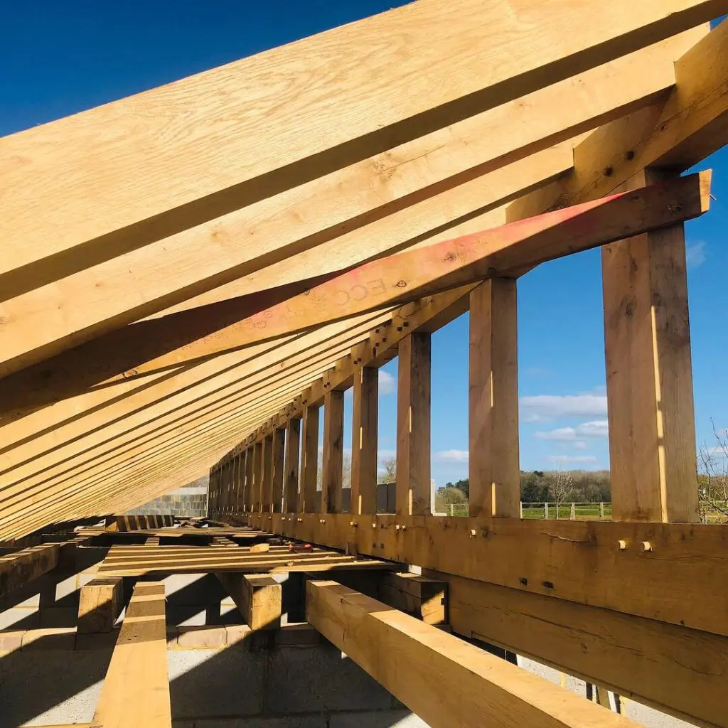 Close up of fresh sawn oak beams used to create a roof structure