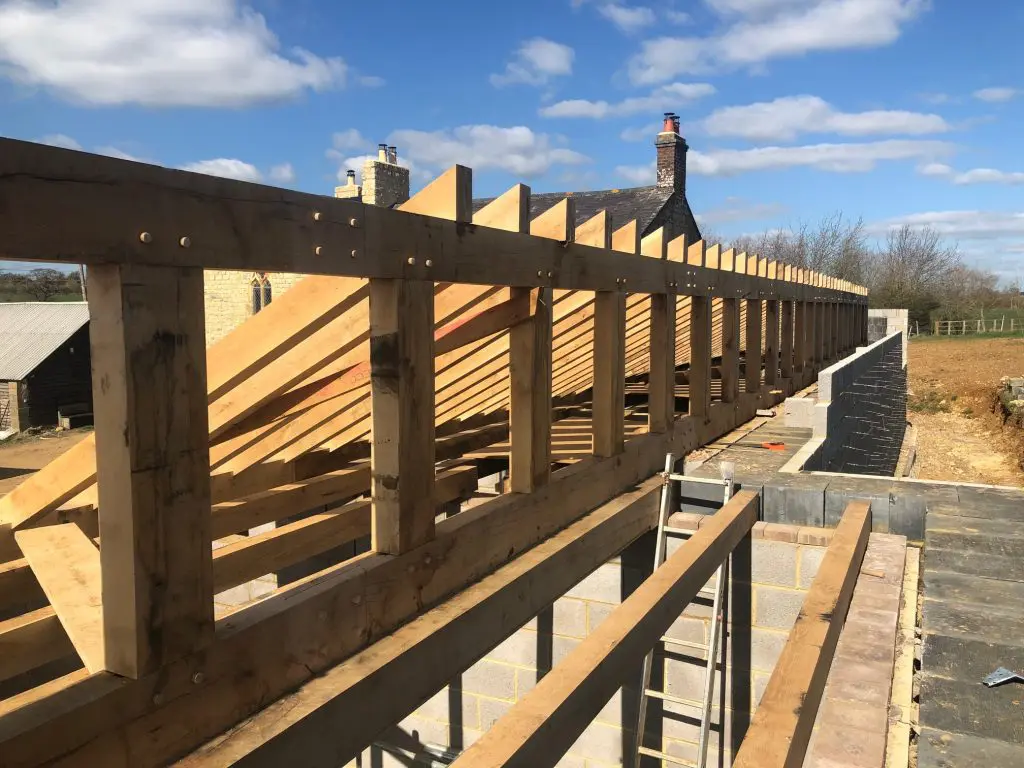 Custom cut fresh sawn oak beams used to create the roof structure