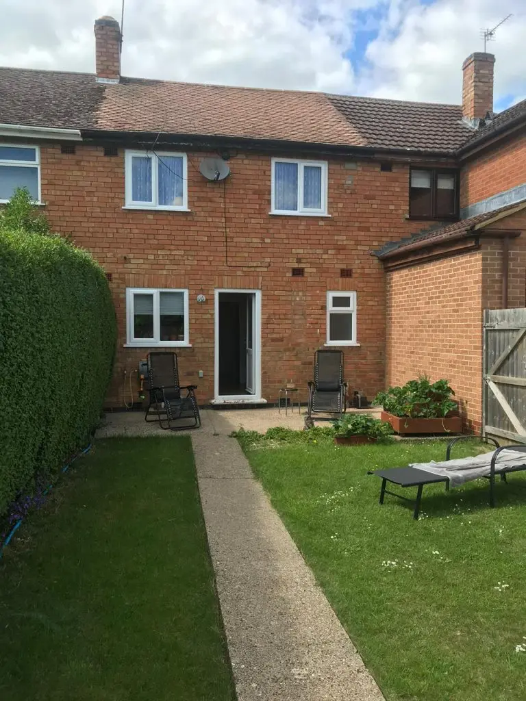 wall-mounted pergola in the back garden to create a back porch