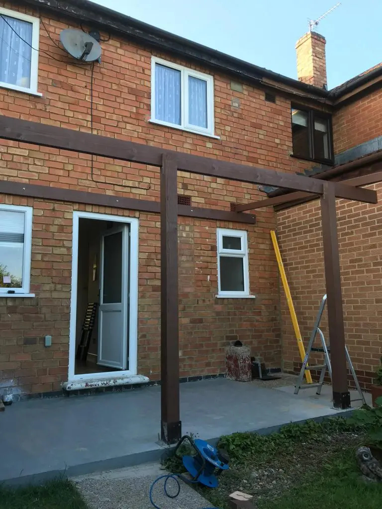 wall-mounted pergola in the back garden to create a back porch