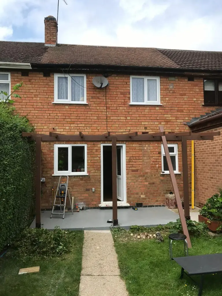 wall-mounted pergola in the back garden to create a back porch