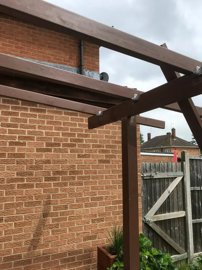 wall-mounted pergola in the back garden to create a back porch