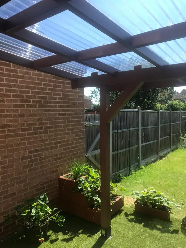 wall-mounted pergola in the back garden to create a back porch