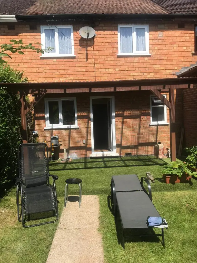 wall-mounted pergola in the back garden to create a back porch