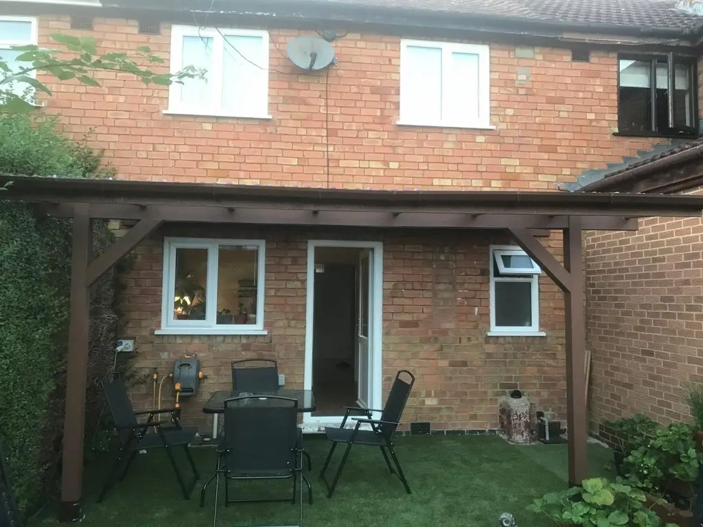 wall-mounted pergola in the back garden to create a back porch