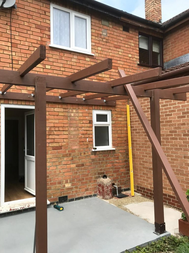 wall-mounted pergola in the back garden to create a back porch