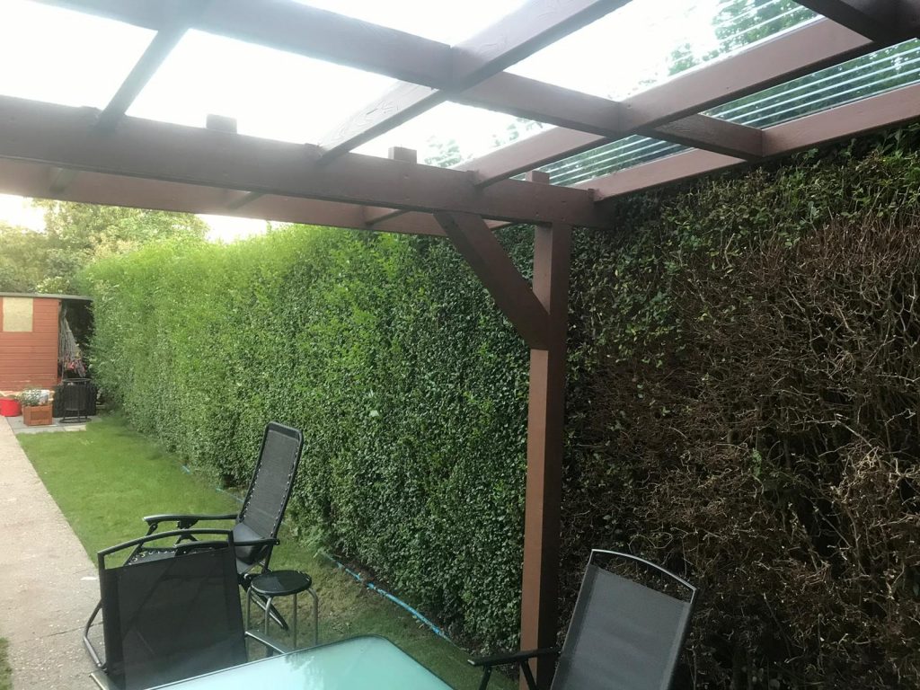 wall-mounted pergola in the back garden to create a back porch