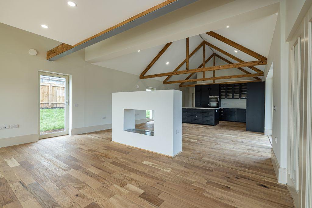 Indoor shot of an unfurnished kitchen with oak exposed beams