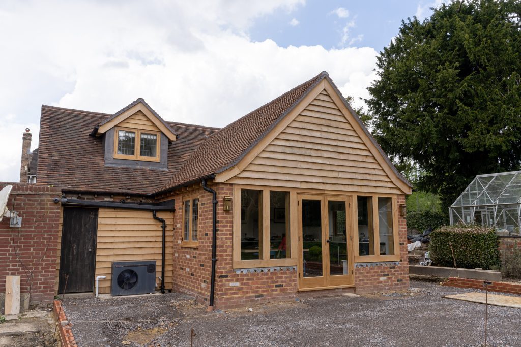 a photo of the finished extensions which was completed using structural green oak beams from uk timber