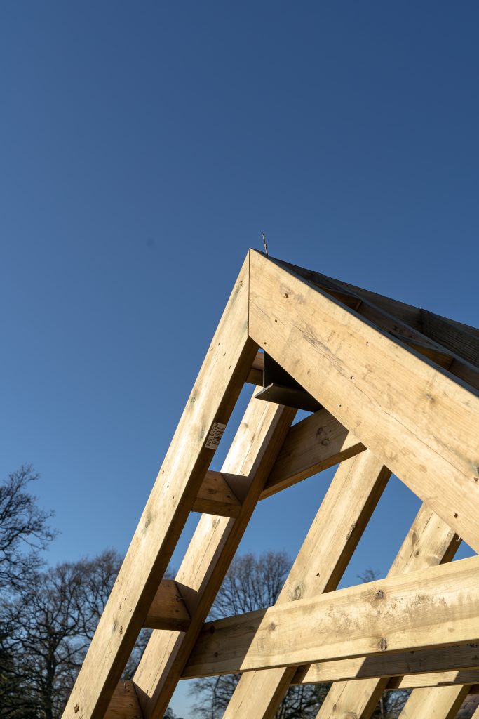 A close up shot of the roofing created using structural green oak beams from UK Timber