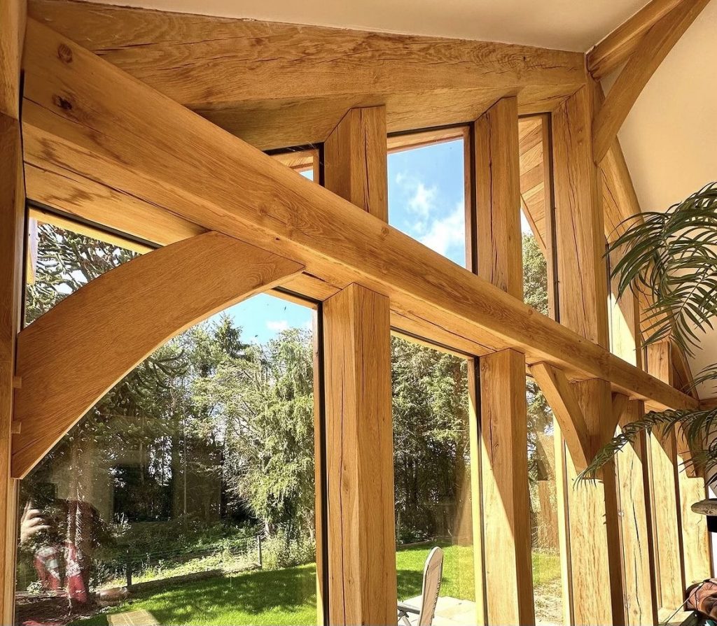 framing of a home extension garden room using green oak beams