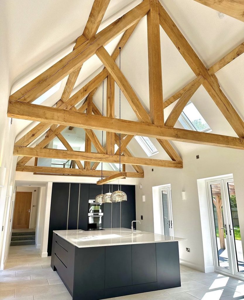 the inside of a kitchen with air dried oak beams roofing king trusses