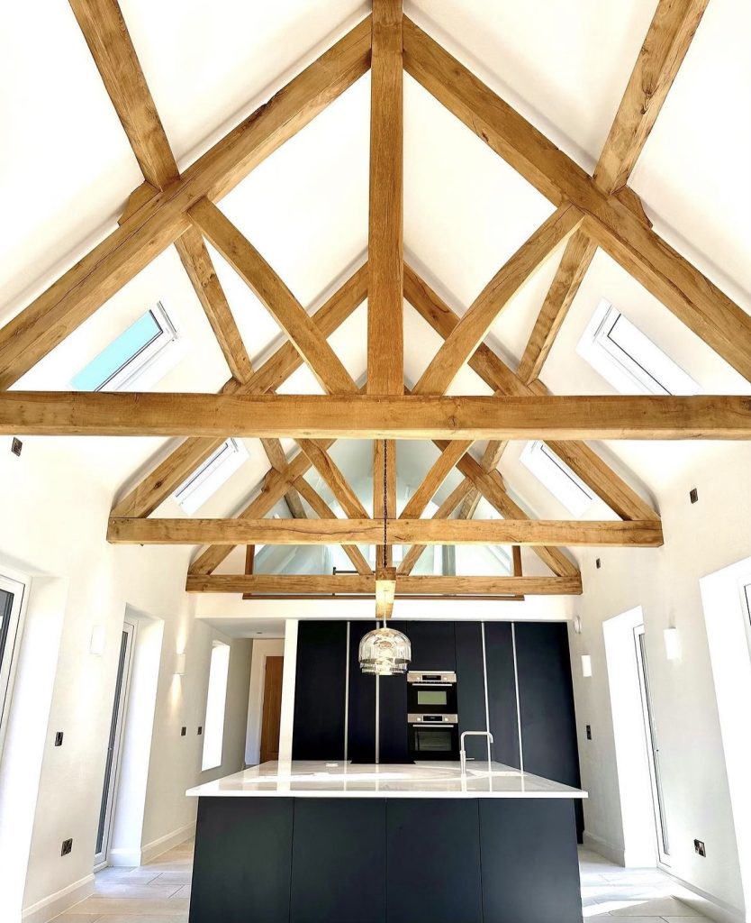 the inside of a kitchen with air dried oak beams roofing king trusses